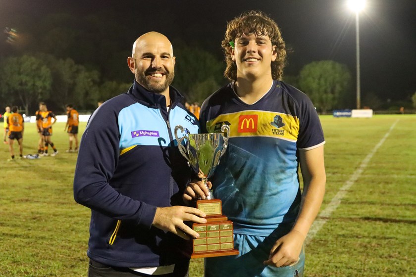 Laffranchi with older son Oscar after defeating the Tigers in 2022.