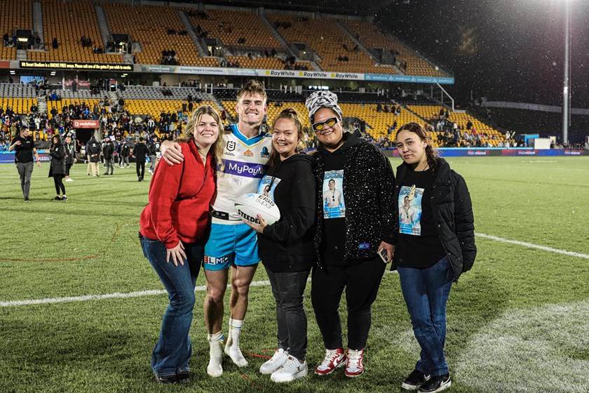 AJ Brimson with Zae Wallace's family after the Titans' 27-26 win against the Warriors in New Zealand.